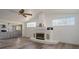 Living room featuring a fireplace and wood-look floors at 15806 Adobe Dr, Hudson, FL 34667