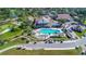 Aerial view of community pool, clubhouse, and golf course at 2476 Silkwood Ct, Spring Hill, FL 34606