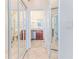 Bathroom with mirrored closet doors and updated vanity at 2476 Silkwood Ct, Spring Hill, FL 34606