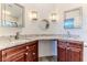 Double vanity bathroom with granite countertops at 2476 Silkwood Ct, Spring Hill, FL 34606