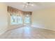 Spacious bedroom with tiled floors and ample natural light at 2476 Silkwood Ct, Spring Hill, FL 34606