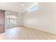 Bright bedroom with tile floors, large window, and ceiling fan at 2476 Silkwood Ct, Spring Hill, FL 34606
