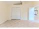 Bright bedroom with tiled floors and a large closet at 2476 Silkwood Ct, Spring Hill, FL 34606