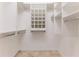 Large walk-in closet with built-in shelving and rods at 2476 Silkwood Ct, Spring Hill, FL 34606