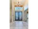 Bright and spacious entryway with double doors and high ceilings at 2476 Silkwood Ct, Spring Hill, FL 34606