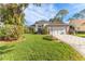 Stunning curb appeal of two-story home with lush landscaping at 2476 Silkwood Ct, Spring Hill, FL 34606