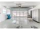 Spacious garage with automatic opener and storage cabinets at 2476 Silkwood Ct, Spring Hill, FL 34606