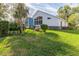 House exterior showcasing a large backyard at 2476 Silkwood Ct, Spring Hill, FL 34606