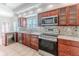 Modern kitchen with stainless steel appliances and granite countertops at 2476 Silkwood Ct, Spring Hill, FL 34606