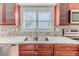 Modern kitchen with granite countertops and stainless steel appliances at 2476 Silkwood Ct, Spring Hill, FL 34606