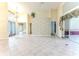 Bright living room with tile floors and large windows at 2476 Silkwood Ct, Spring Hill, FL 34606