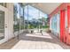 Spacious screened porch with tile floor and view of backyard at 2476 Silkwood Ct, Spring Hill, FL 34606