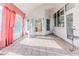 Bright screened porch with view of kitchen and backyard at 2476 Silkwood Ct, Spring Hill, FL 34606