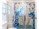 Shower with a beautiful peacock-themed glass enclosure at 2476 Silkwood Ct, Spring Hill, FL 34606