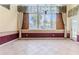 Sunroom with tile floors and multiple windows at 2476 Silkwood Ct, Spring Hill, FL 34606