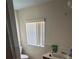 Small bathroom with single sink, toilet and window at 3234 Ella Ln, New Port Richey, FL 34655