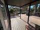 Wooden deck with a view of the backyard and a chair at 3234 Ella Ln, New Port Richey, FL 34655
