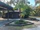 Home exterior with covered carport and landscaping at 3234 Ella Ln, New Port Richey, FL 34655