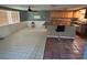 Kitchen features an island and wood cabinets at 3234 Ella Ln, New Port Richey, FL 34655