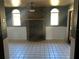Living room with brick fireplace and tiled floor at 3234 Ella Ln, New Port Richey, FL 34655