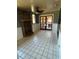 Living room with tiled floors, fireplace, and French doors at 3234 Ella Ln, New Port Richey, FL 34655