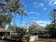 Above ground pool with palm trees and homes at 3234 Ella Ln, New Port Richey, FL 34655