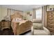 Bedroom with an ornate bed frame, light beige recliner, and a dresser at 3337 Darlington Rd, Holiday, FL 34691