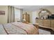 Bedroom with a large dresser, comfortable bed, and window with blinds at 3337 Darlington Rd, Holiday, FL 34691