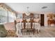 Formal dining room with wooden table and chairs, chandelier and artwork at 3337 Darlington Rd, Holiday, FL 34691