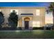 Charming two-story home featuring a well-maintained front yard and classic architectural details at 6334 Timberly Ln, Zephyrhills, FL 33542