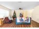 Inviting living room with wood floors, neutral walls, and plenty of natural light at 6334 Timberly Ln, Zephyrhills, FL 33542