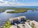 Waterfront property, showcasing condo building and parking at 8150 Brent St # 746, Port Richey, FL 34668