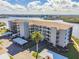 Aerial view of waterfront condo building with parking at 8150 Brent St # 746, Port Richey, FL 34668