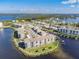 Aerial view of waterfront community, featuring multiple buildings and boat slips at 8150 Brent St # 746, Port Richey, FL 34668