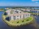 Aerial view of waterfront community, showcasing its location and landscaping at 8150 Brent St # 746, Port Richey, FL 34668