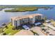 Waterfront condo building, parking, boat slips, and lush landscaping at 8150 Brent St # 746, Port Richey, FL 34668