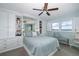 Spacious bedroom with built-in storage and a ceiling fan at 8150 Brent St # 746, Port Richey, FL 34668