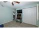 Bedroom with TV, antique desk and built-in closet at 8150 Brent St # 746, Port Richey, FL 34668