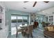 Bright dining area with water views and built-in shelving at 8150 Brent St # 746, Port Richey, FL 34668