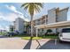 Three-story condo building with parking and landscaping at 8150 Brent St # 746, Port Richey, FL 34668