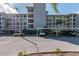 Three-story condo building with covered parking at 8150 Brent St # 746, Port Richey, FL 34668