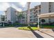 Condo building showcasing its architecture and landscaping at 8150 Brent St # 746, Port Richey, FL 34668