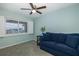 Guest room with blue couch and water view at 8150 Brent St # 746, Port Richey, FL 34668
