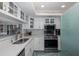 Modern kitchen with stainless steel appliances and white cabinets at 8150 Brent St # 746, Port Richey, FL 34668
