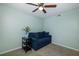 Small sitting area with blue couch and side table at 8150 Brent St # 746, Port Richey, FL 34668