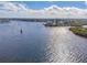 Boat on calm water near waterfront property with lush vegetation at 8150 Brent St # 746, Port Richey, FL 34668