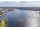 Wide shot of a waterway with houses and boats on a sunny day at 8150 Brent St # 746, Port Richey, FL 34668