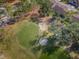 Golf course green with sand traps aerial view at 9609 Brookdale Dr, New Port Richey, FL 34655