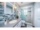 Updated bathroom with a modern walk-in shower and stylish tile at 9609 Brookdale Dr, New Port Richey, FL 34655