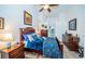 King-size bed in a well-lit bedroom with access to a full bath at 9609 Brookdale Dr, New Port Richey, FL 34655